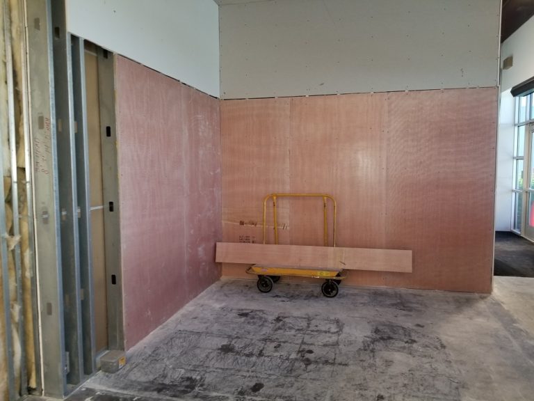 Bullet-resistant fiberglass panels can be installed over existing wall or new construction