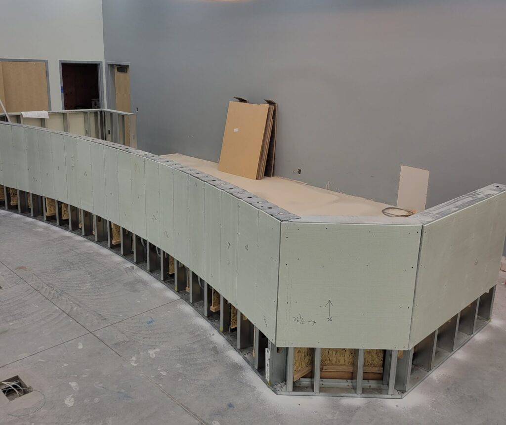 Bullet resistant fiberglass panels on a curved Dia's desk