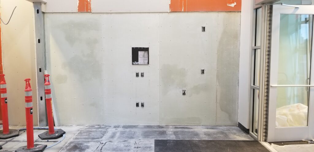Level 3 fiberglass wall armor installed onto existing walls